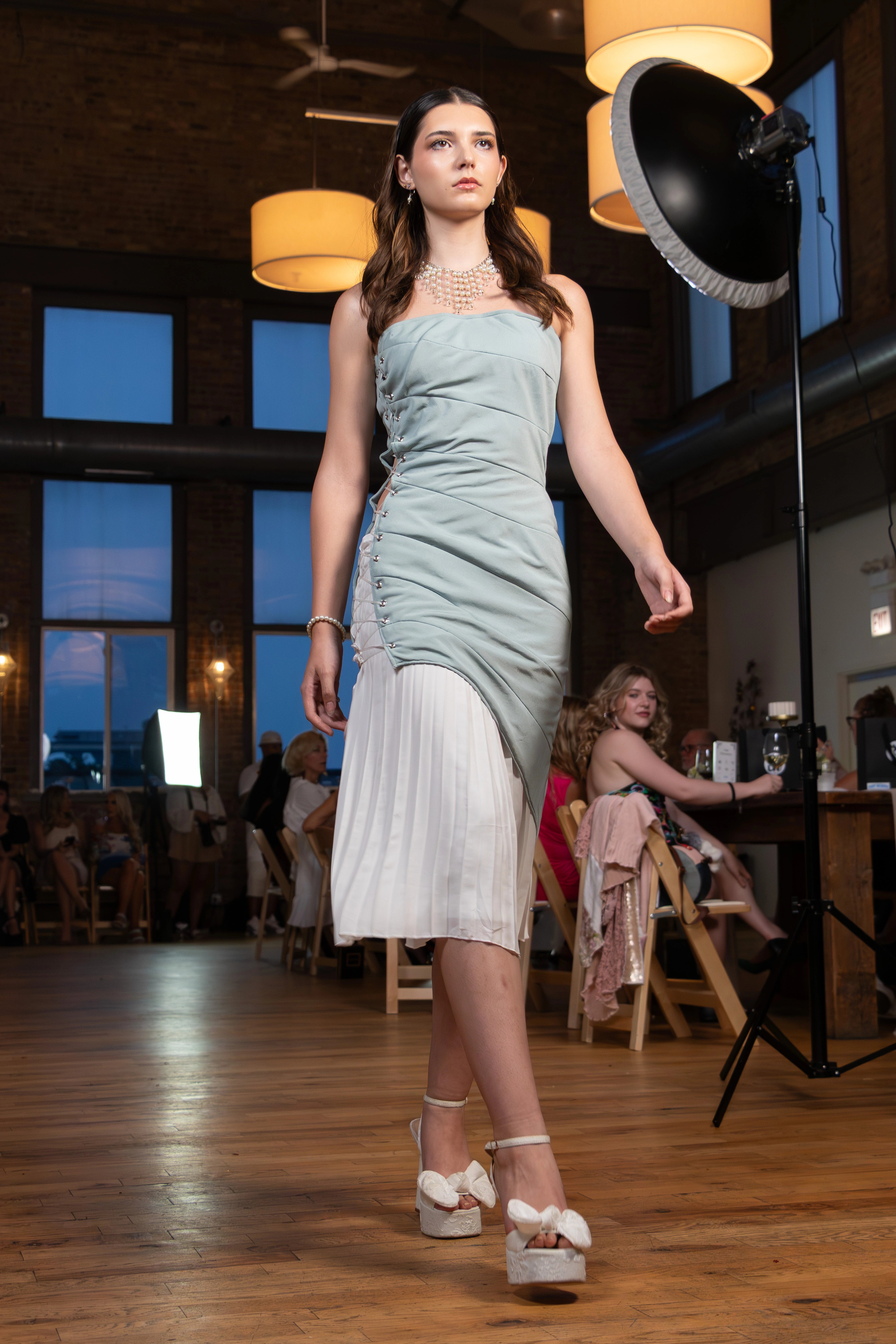 Runway — evening look in mint with pleated white skirt